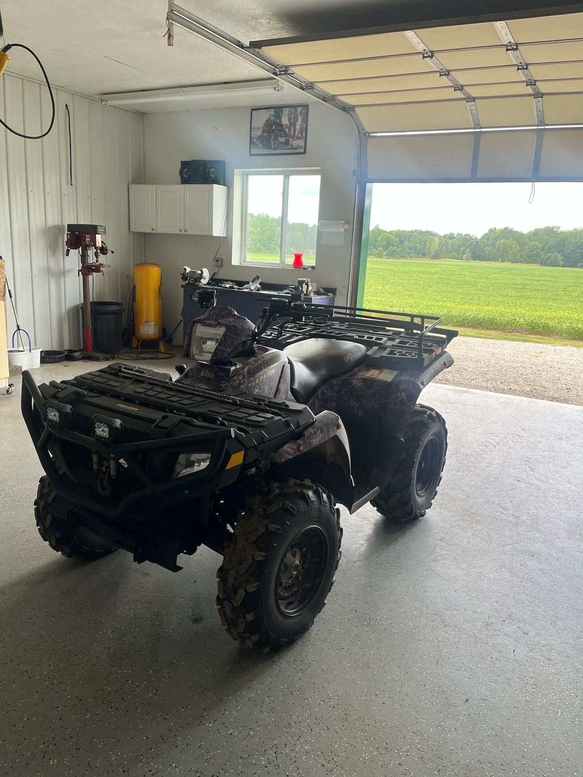ATV tearing through a muddy trail